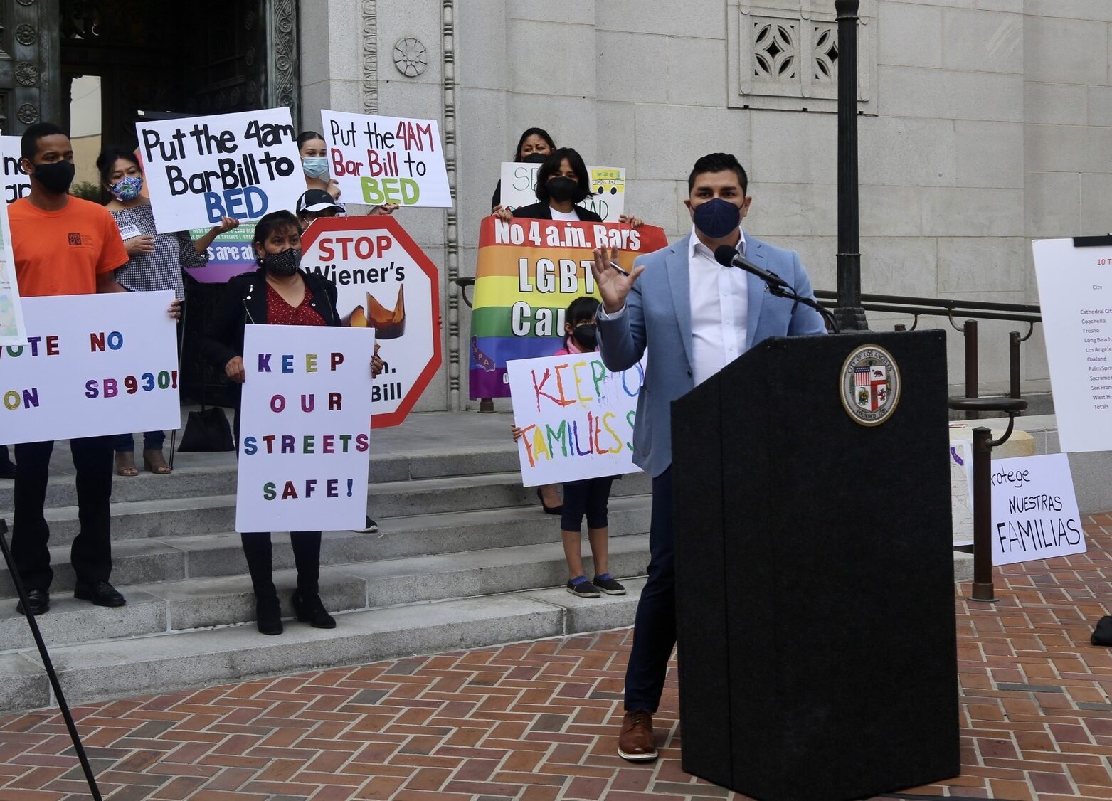 Executive Director of Alcohol Justice, Cruz Avila, giving a speech in front of government building